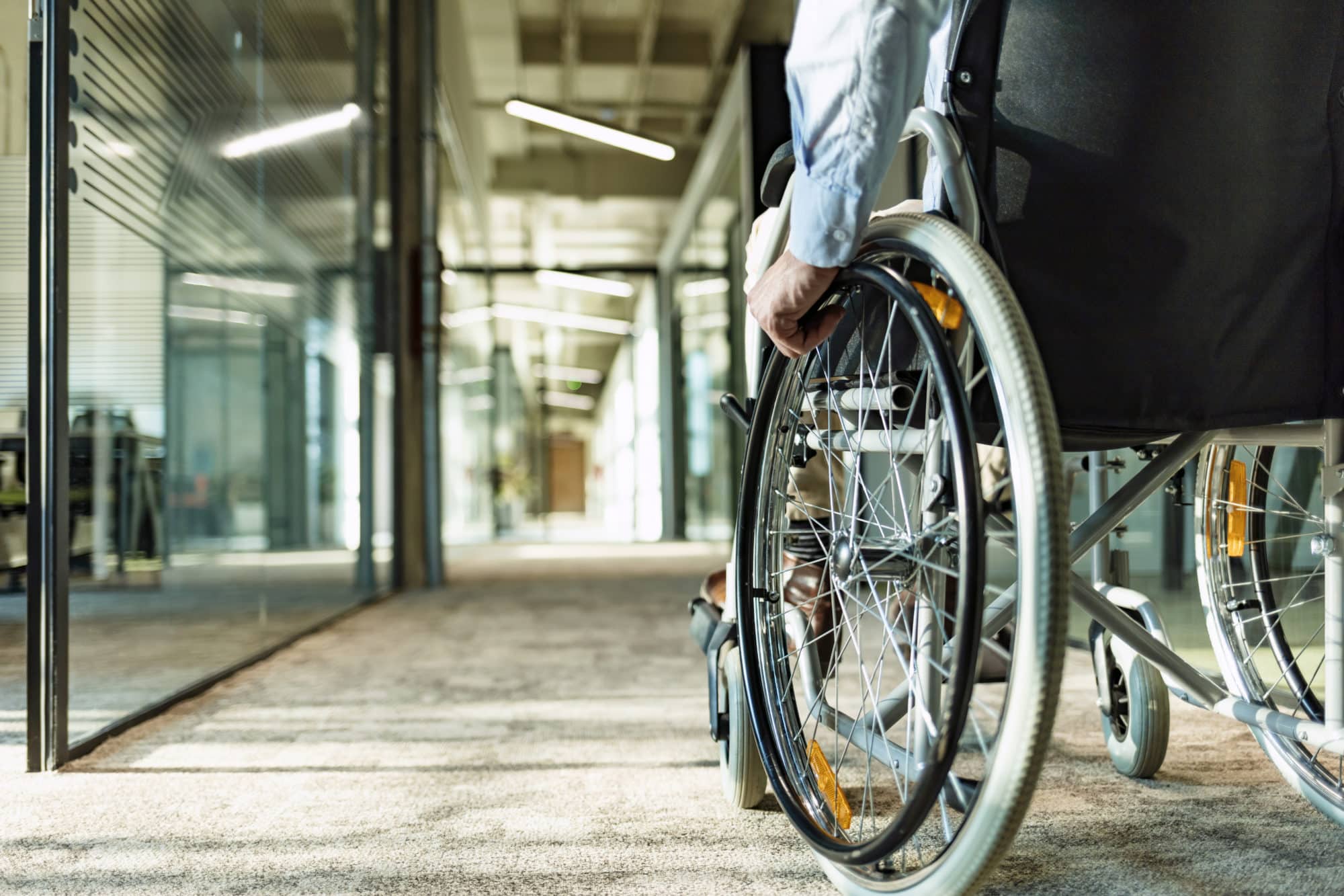 a person in a wheelchair navigating a hallway in Long Beach