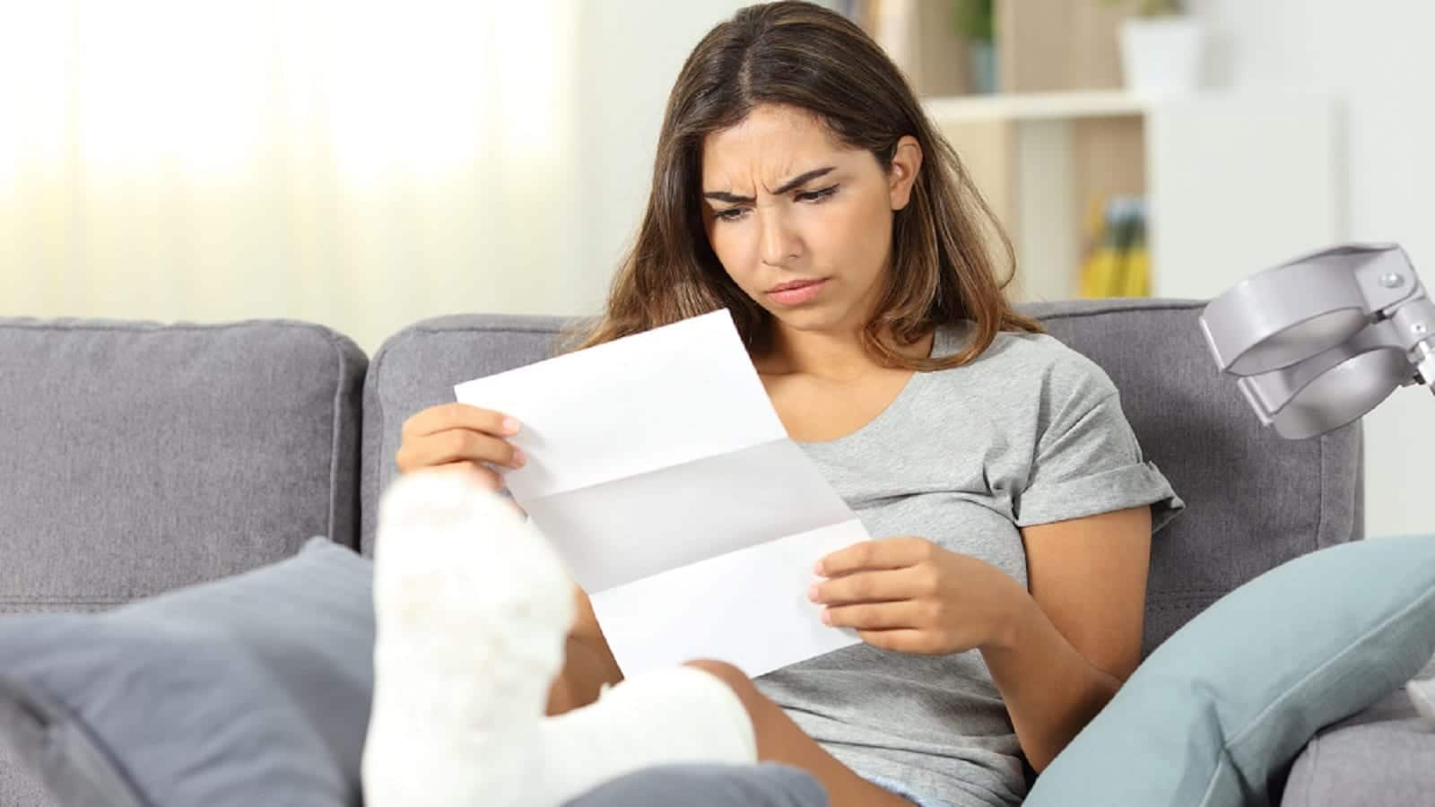 Disabled Woman Reviewing Billing Statement Stock Photo