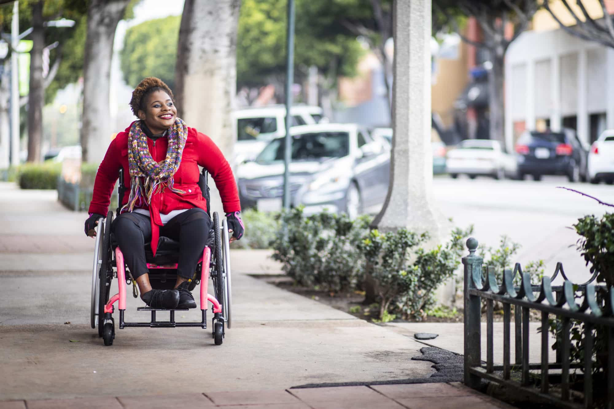 a woman in a wheelchair on the sidewalks of Los Angeles